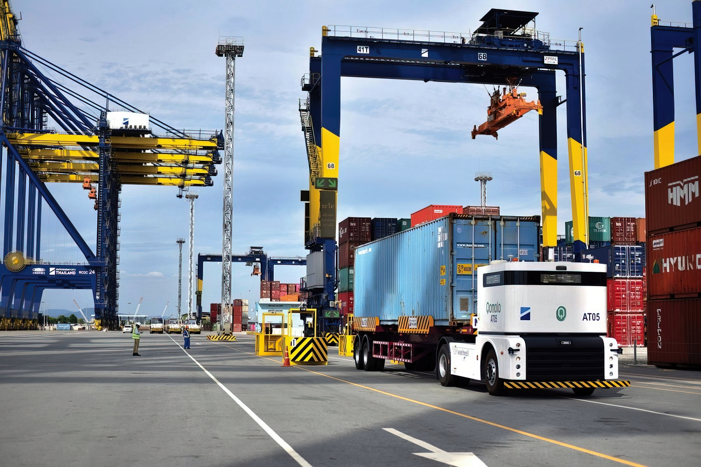  Westwell Q-Truck operating at Laem Chabang Port, moving containers under intelligent dispatching in a smart port terminal.