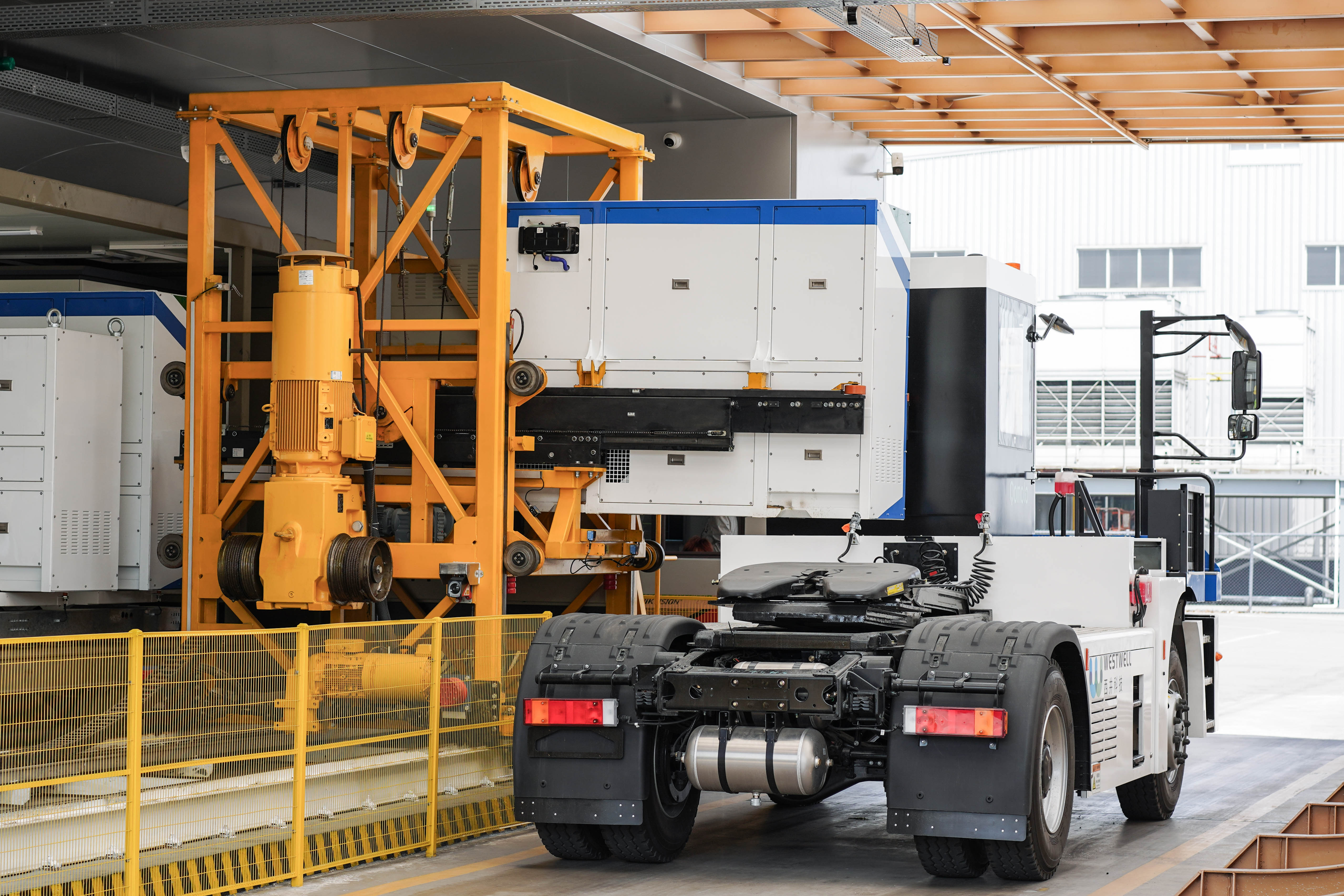 Westwell PowerOnAir battery swap system for electric autonomous trucks performing battery swapping at a smart port.